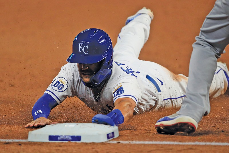 Royals outfielder Whit Merrifield slides into third base during the sixth inning of Wednesday's game against the Cubs at Kauffman Stadium in Kansas City. Merrifield advanced to third on a foul out by teammate Jorge Soler.