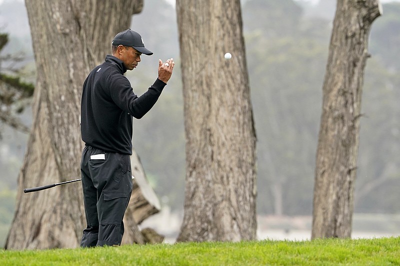 Tiger Woods tosses a ball down on the 17th hole during a practice round Wednesday for the PGA Championship at TPC Harding Park in San Francisco.