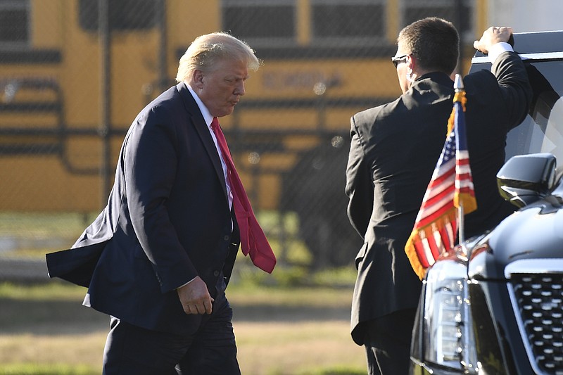 President Donald Trump walks to his car after arrive in Southampton, N.Y., on Marine One, Saturday, Aug. 8, 2020. Trump is attending two fundraisers during his visit to the Hamptons. (AP Photo/Susan Walsh)