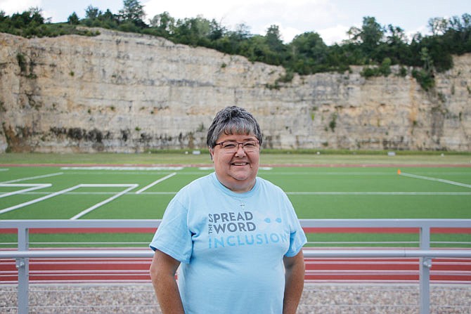 Susan Shaffer, Special Olympics Missouri Outreach and Games Director, stands Wednesday for a portrait in front of the playing field at SOMO's new building. 