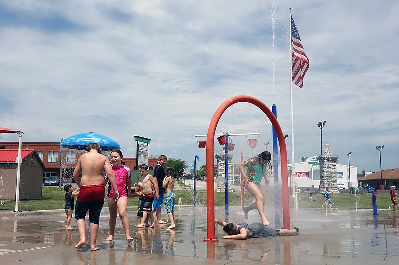 <p>Helen Wilbers/FULTON SUN</p><p>Though Fulton’s annual Bubble Blowout event was canceled Monday, area children stayed cool at the Fulton Splash Pad. After a break from the scorching heat of summer following rain in late July, Mid-Missouri’s temperature jumped back to the 90s. Monday’s high was around 93 degrees, with a heat index well more than 100.</p>
