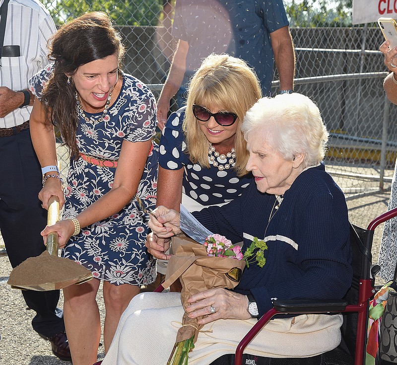 Missy Bonnot, middle, assists Betty "BJ" DeLong, seated, Monday, Aug. 10, 2020, to scoop a miniature shovel of dirt out of a shovel held by Mayor Carrie Tergin during a groundbreaking ceremony for the Bicentennial Bridge. Bonnot, who serves as the president of the Jefferson City Area Chamber of Commerce, joined about 100 other interested parties as ground was officially broken on the northeast corner of the Capitol grounds. DeLong donated more than $3 million to the project.