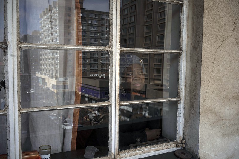 Sibongile Zulu poses for a portrait inside her home in Johannesburg, South Africa, Tuesday, July 28, 2020. Zulu is HIV positive and couldn't get her full medication for two months due to a lack of stock in government pharmacies. Across Africa and around the world, the COVID-19 pandemic has disrupted the supply of antiretroviral drugs to many of the more than 24 million people who take them, endangering their lives. An estimated 7.7 million people in South Africa are HIV positive, the largest number in the world, and 62% of them take the antiretroviral drugs that suppress the virus and prevent transmission. (AP Photo/Bram Janssen)