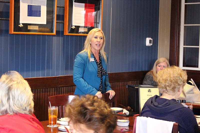 FILE- In this March 3, 2020 file photo, Republican Marjorie Taylor Greene speaks to a GOP women's group in Rome, Ga. Greene faces neurosurgeon John Cowan in a primary runoff election on Tuesday, Aug. 11 in northwest Georgia's 14th Congressional District. (John Bailey/The Rome News-Tribune via AP)