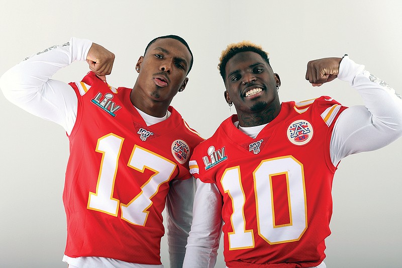 In this Jan. 27 file photo, Chiefs receivers Mecole Hardman (left) and Tyreek Hill pose for a photo during the week before Super Bowl LIV in Miami.