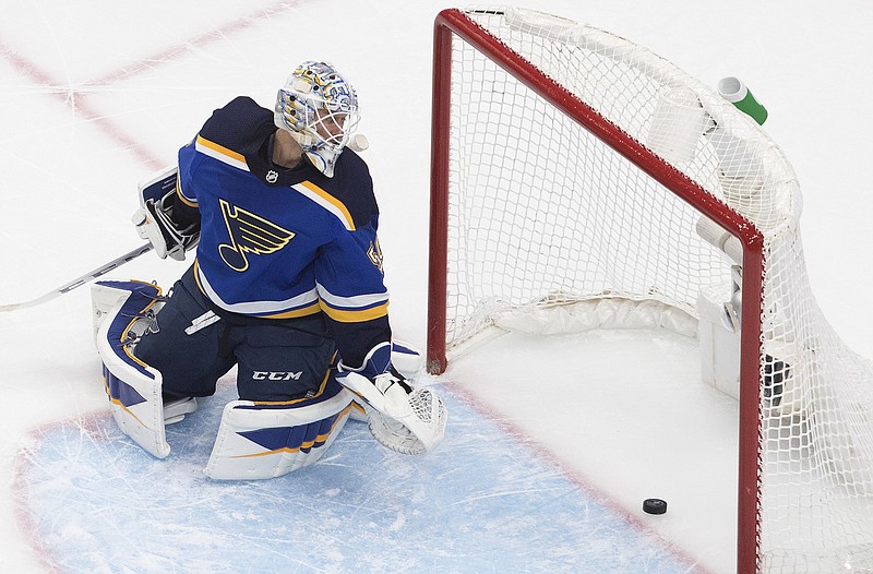 Blues goalie Jordan Binnington looks back at the puck on a goal by the Canucks during the third period in Game 1 of a Western Conference first-round playoff series Wednesday in Edmonton, Alberta.