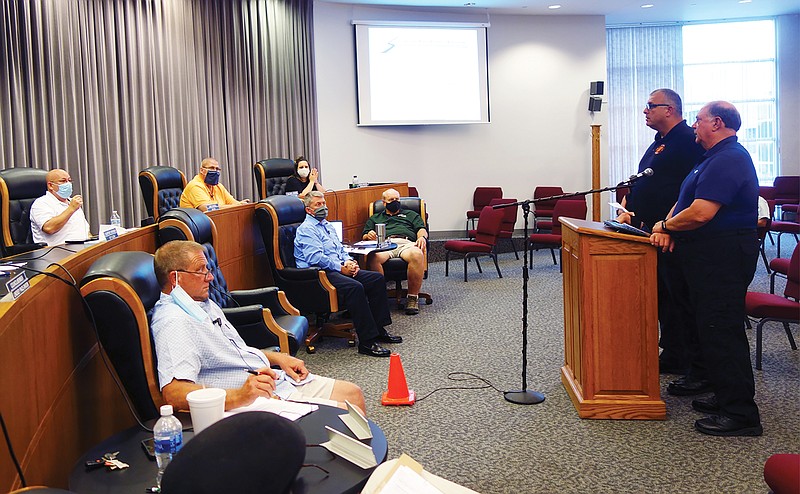 During Tuesday night's Fulton City Council meeting, Fulton Police Chief Steve Myers, right, and Fulton Fire Chief Kevin Coffelt outline potential ways to end the "fireworks wars," a 4th of July tradition that's allegedly grown into an annual hazard in the Carver Park area. 