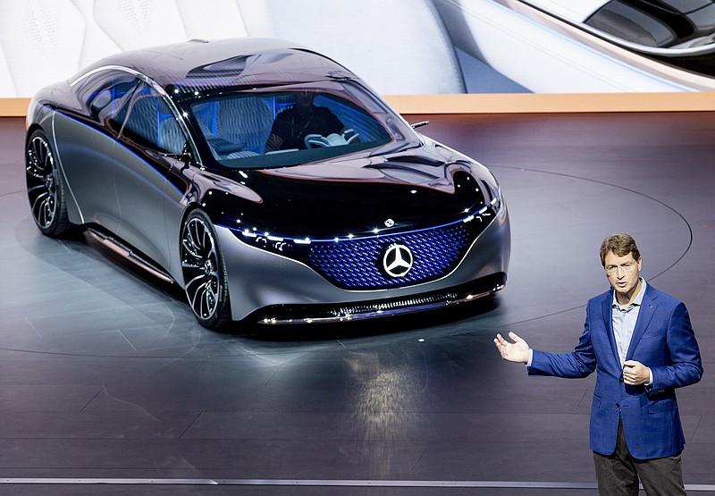 FILE - In this Tuesday, Sept. 10, 2019 file photo Ola Kaellenius, CEO of the car manufacturer Mercedes, stands next to a 'Vision EQS' car at the IAA Auto Show in Frankfurt, Germany. On Tuesday, Feb. 11, 2020 Daimler AG, maker of Mercedes-Benz cars, issues fourth-quarter and full year earnings and provides business update at news conference. (AP Photo/Michael Probst, file)