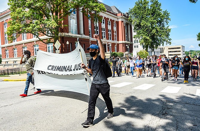 About 70 protesters from the group ExpectUs started out at the Capitol on Thursday, making their way down the sidewalks of High Street. The group opposes Gov. Mike Parson's legislative agenda for the ongoing special session to address violent crime in the state.