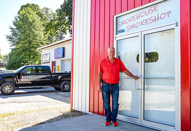 Julie Smtih/News Tribune
Doug Mueller, owner of the new Smokehouse Smokeshop on E. McCarty Street, where he also owns Mueller High Performance Auto. The new shop will feature a large selection of beers and liquors and tobacco.