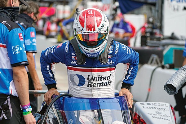 Graham Rahal climbs into his car during practice Friday for the Indianapolis 500 at Indianapolis Motor Speedway in Indianapolis.