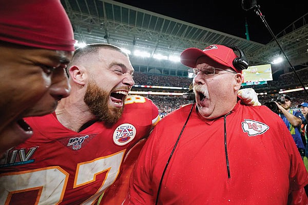 In this Feb. 2 file photo, Chiefs' tight end Travis Kelce celebrates with coach Andy Reid after defeating the 49ers in Super Bowl LIV in Miami Gardens, Fla.