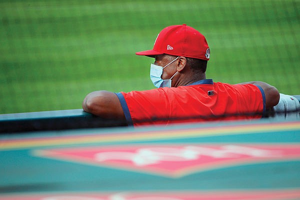 Cardinals instructor and former player Willie McGee watches workouts last month during summer camp training at Busch Stadium.