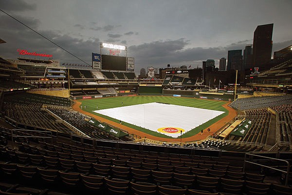 Rain falls postponing Friday's game between the Royals and Twins in Minneapolis.