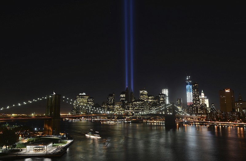 FILE - In this Sept. 11, 2012 file photo, The Tribute in Light lights up lower Manhattan in New York, twin columns of light beamed into the Manhattan sky to represent the World Trade Center.  (AP Photo/Henny Ray Abrams, File)