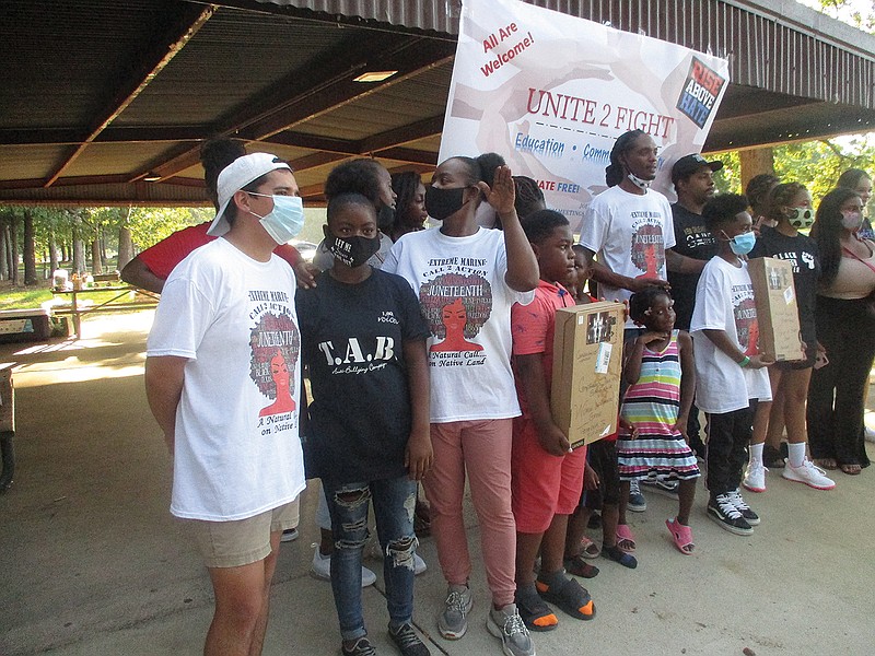 Members of Black Lives Matter, Women of Honor and Taking Action Against Bullies met Saturday evening at Spring Lake Park as part of a recently formed new organization known as "Unite 2 Fight." The organization focuses on community, unity and education.