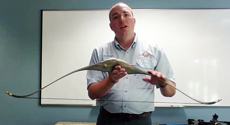 <p>Submitted photo</p><p>Runge Nature Center Naturalist Sam Stewart explains the differences between a recurve bow and a longbow Tuesday during a “Summer Surprises” program. These virtual programs feature a brief talk on a family-friendly surprise topic.</p>