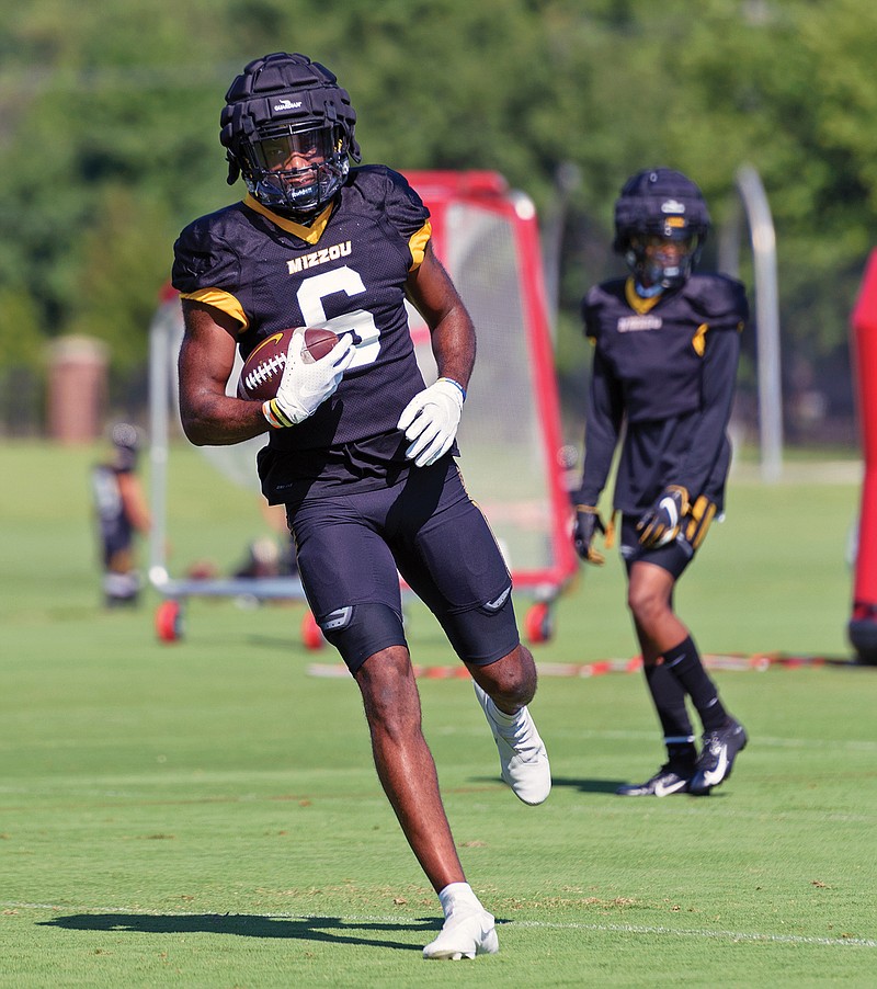 Missouri wide receiver Keke Chism runs through a drill during Wednesday's fall camp practice in Columbia. Chism, a transfer from Division II Angelo State, is the Tigers' first newcomer to earn a jersey number.