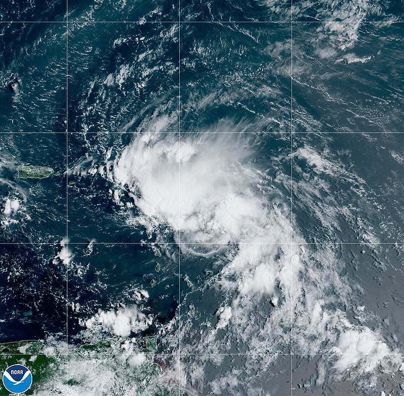 This satellite image released by the National Oceanic and Atmospheric Administration (NOAA) shows Tropical Storm Laura in the North Atlantic Ocean, Friday, Aug. 21, 2020. Laura formed Friday in the eastern Caribbean and forecasters said it poses a potential hurricane threat to Florida and the U.S. Gulf Coast. A second storm also may hit the U.S. after running into Mexico's Yucatan Peninsula. (NOAA via AP)