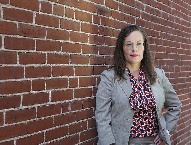 Ward 3 Councilwoman Erin Wiseman poses for a portrait Tuesday next to the law office in which she works. Her desire to run for elected office came from her family — her father's own work in an elected seat and inspiration from her aunt.