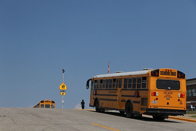 School buses wait Tuesday, Aug. 25, 2020, for students to board them at the end of the school day at Thorpe J. Gordon Elementary School in Jefferson City.