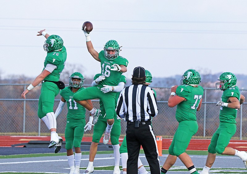Blair Oaks wide receiver Jake Closser (center) celebrates with his teammates after scoring a touchdown in the first quarter of last year's Class 3 quarterfinal game against Cassville at the Falcon Athletic Complex in Wardsville.