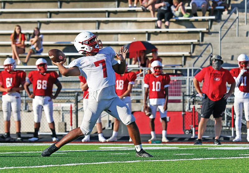 Jays quarterback Zane Wings throws a pass downfield during a scrimmage last week at Adkins Stadium.