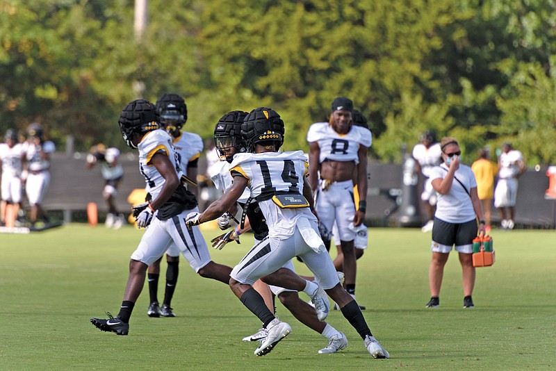 Missouri cornerback Adam Sparks (14) goes through a defensive drill during Wednesday's practice in Columbia. Sparks' parents in Louisiana are preparing for Hurricane Laura, while his brother Jared, a football player at Purdue, had his season canceled.