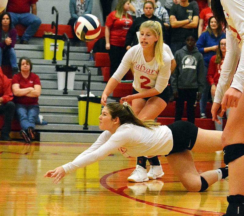 Calvary Lutheran defensive specialist Hannah Scheperle digs the ball during last 