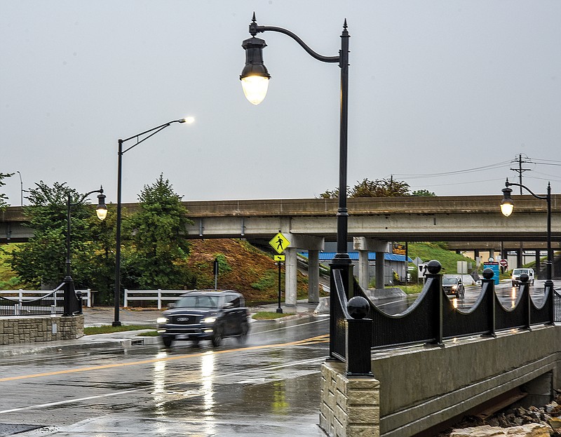 Decorative lighting has been installed on the Dunklin Street bridge to complete the project. Work to replace the bridge started in 2019, but due to flood water backed up in Wears Creek, that portion of the project had to be delayed until this spring. Meanwhile, crews worked to install new stormwater drains, curb and gutter, and more. This spring, the project resumed and is now complete. The new, wider bridge includes a sidewalk on the south side and Greenway path on the north side of the bridge. Due to Monday's storm creating a dark sky, the lights came on midday and drawing attention to them.