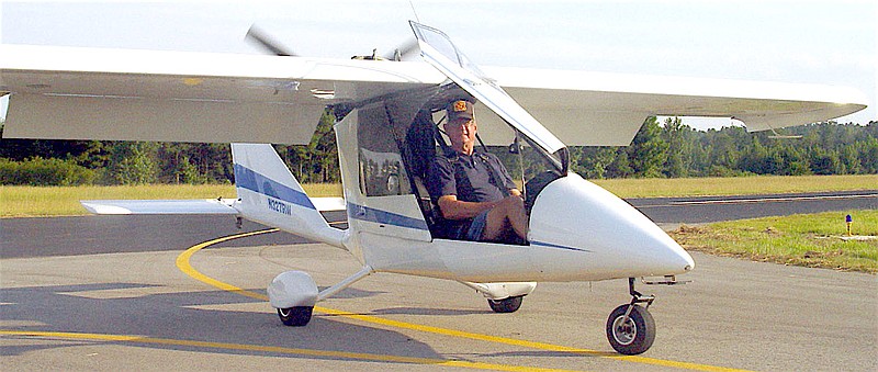 Richard Humber has just landed in his sports category light aircraft at the Atlanta Airport. Note the plane is pushed rather than pulled by the engine.