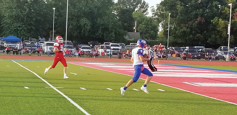 California's Calen Kruger heads to the end zone for one of his three rushing touchdowns last Friday in the Pintos' 61-21 win against Clinton at Clinton.