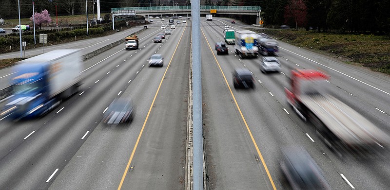  In this Monday, March 25, 2019, file photo, cars and trucks travel on Interstate 5 near Olympia, Wash. A new study says that safety features such as automatic emergency braking and forward collision warnings could prevent more than 40% of crashes in which semis rear-end other vehicles. (AP Photo/Ted S. Warren, File)