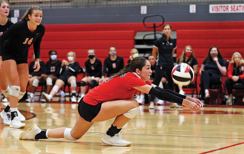Jefferson City libero Sydney Vogt goes down to the floor for a dig during Thursday night's match against Hermann at Fleming Fieldhouse.
