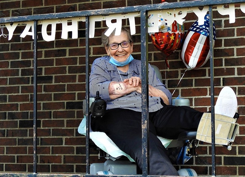 <p>Submitted</p><p>Abbie Akers smiles at family and friends as they drive by in a drive-thru celebration of her birthday.</p>