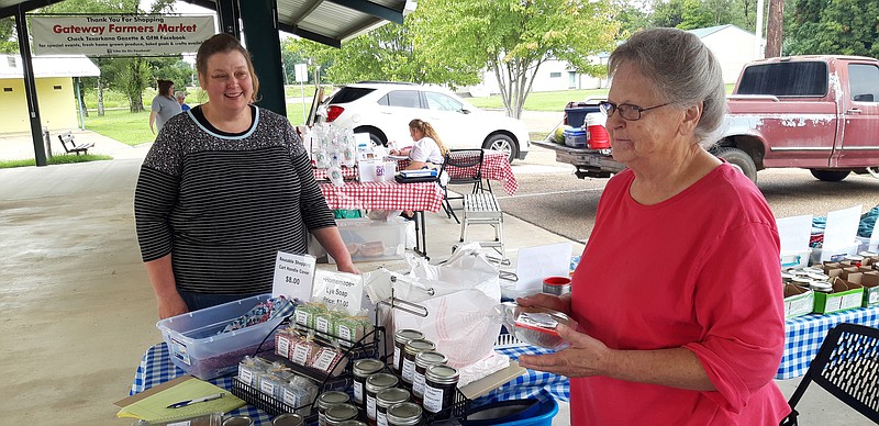 Three generations the Gateway Farmers Market a family tradition. Mary Littleton, right, is mother to Cindy Gladden, left, and has managed Gateway for a year. Her daughter Tori, seen in the background in the middle, also sells at the market and is studying for her nursing degree.
