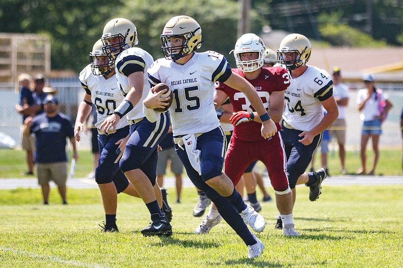 Helias JV quarterback Drew Miller runs the ball during the second quarter of Saturday afternoon's game against Tipton at Tipton.
