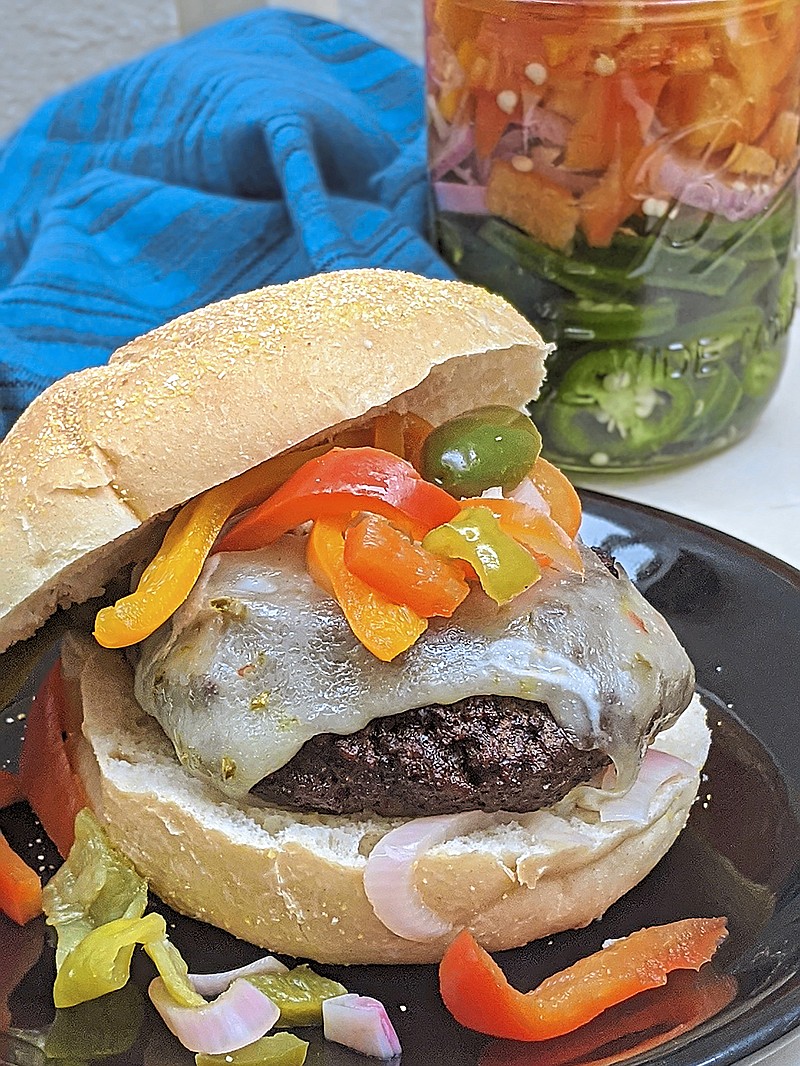 Sweet and spicy pickled peppers add color and a bit of heat to a grilled burger. (Gretchen McKay/Pittsburgh Post-Gazette/TNS)