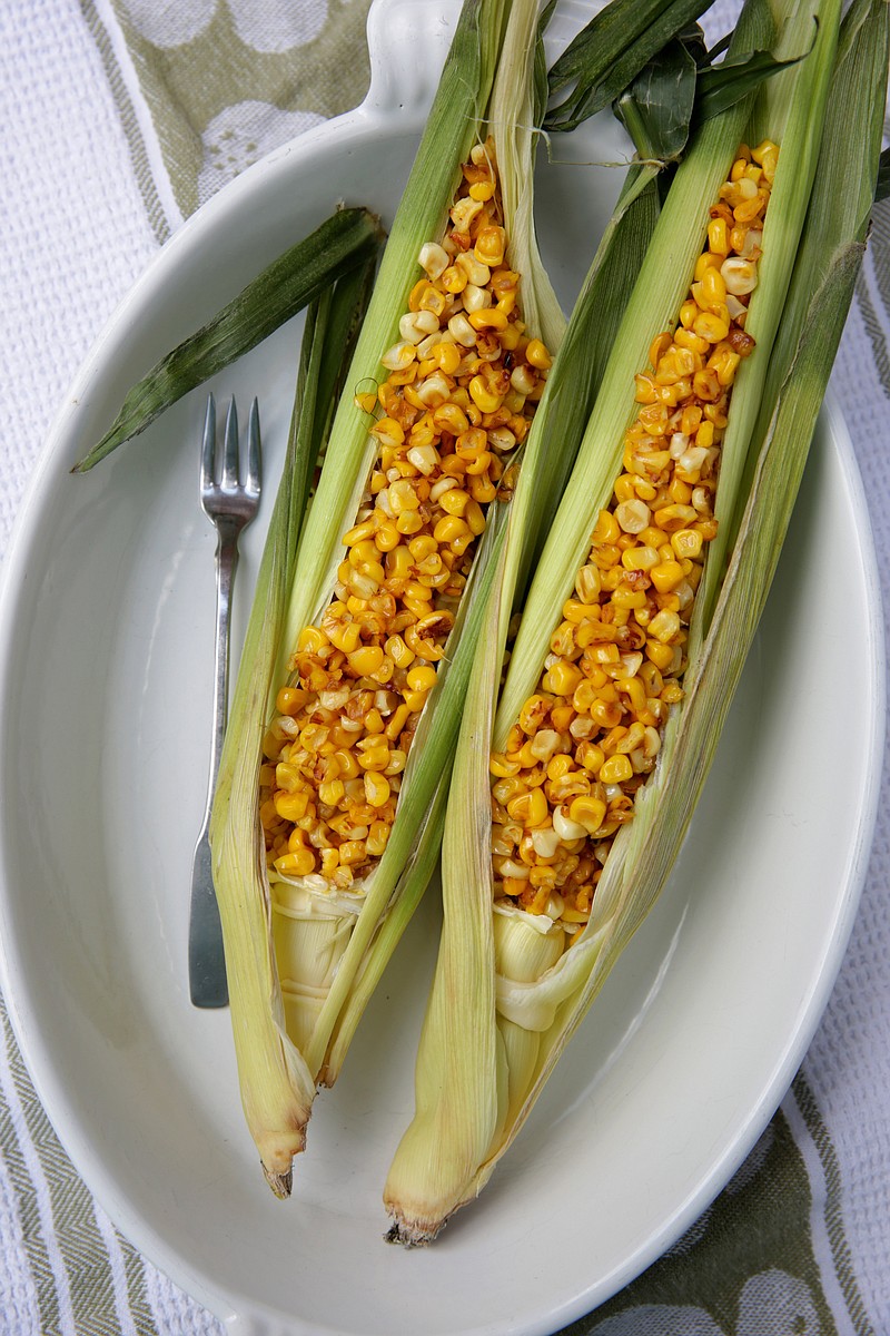 Pan-Roasted corn, off the cob, served in corn husks, photographed Wednesday, Aug. 5, 2020. (Hillary Levin/St. Louis Post-Dispatch/TNS)