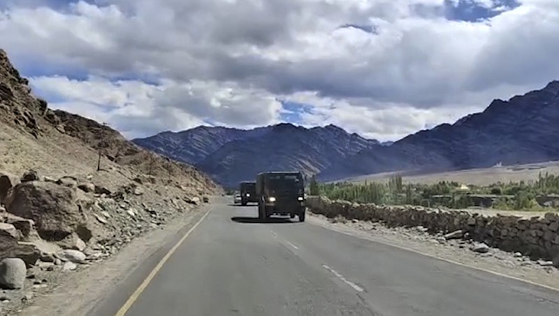 This frame grab from video shows an Indian army convoy driving in Leh, India. India and China accused each other on Tuesday of making provocative military moves and firing warning shots along their disputed border despite talks on ending the escalating tensions. The nuclear-armed rivals have been engaged in a tense standoff in the cold-desert Ladakh region since May, and their defense ministers met Friday in Moscow in the first high-level direct contact between the sides since the standoff began. (AP Photo)