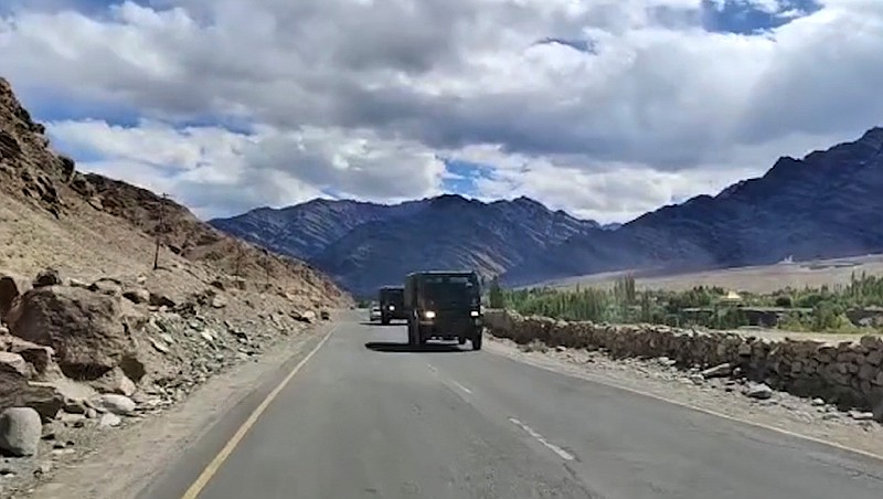 This frame grab from video shows an Indian army convoy driving in Leh, India. India and China accused each other on Tuesday of making provocative military moves and firing warning shots along their disputed border despite talks on ending the escalating tensions. The nuclear-armed rivals have been engaged in a tense standoff in the cold-desert Ladakh region since May, and their defense ministers met Friday in Moscow in the first high-level direct contact between the sides since the standoff began. (AP Photo)