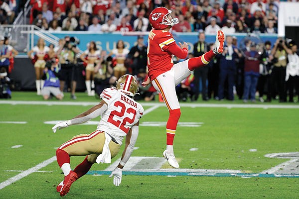 In this Feb. 2 file photo, Dustin Colquitt punts the ball for the Chiefs during the first half of Super Bowl LIV against the 49ers in Miami Gardens, Fla.