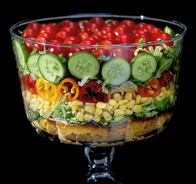 Built on a layer of savory cornbread, the summer trifle salad is made with shredded romaine lettuce, sweet corn, mini peppers, cucumbers and cherry tomatoes. Shot in Oakmont, Pennsylvania on Friday, August 21, 2020. (Steve Mellon/Pittsburgh Post-Gazette/TNS)