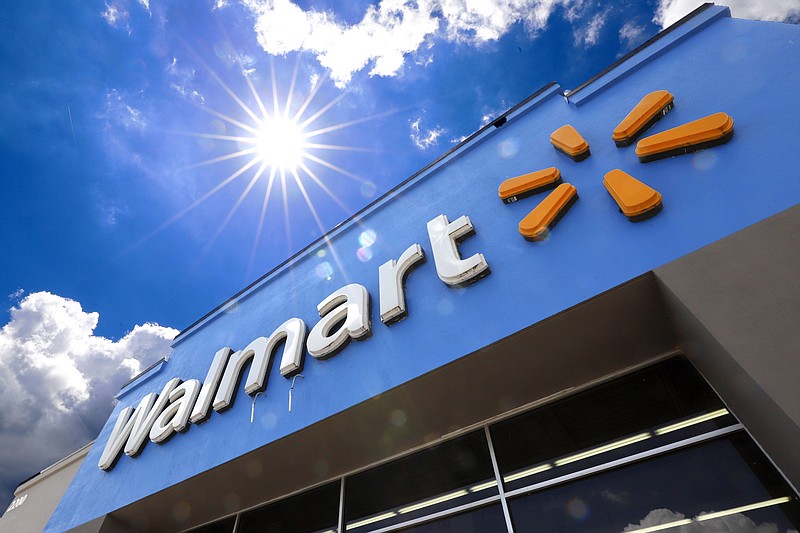 FILE - This June 25, 2019, file photo shows the entrance to a Walmart in Pittsburgh. Walmart launched a pilot program Wednesday, Sept. 9, 2020, using drones to deliver groceries and household essentials in a North Carolina city. The retail giant is using drones from Flytrex in Fayetteville, where it says it hopes to gain insight into customers' and its workers' experience with the technology. (AP Photo/Gene J. Puskar, File)