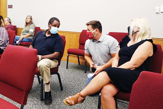 A number of firework sales tent operators spoke against a proposed firework ban during Tuesday evening's Fulton City Council meeting. Those pictured include Mike Gardner, left, Dava Gardner, Charles Galbreath (who did not speak), Ben Muzzey and Susan Peterson, Galbreath's business partner.