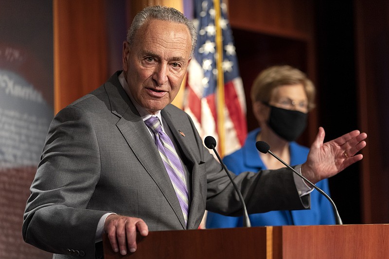 Senate Minority Leader Sen. Chuck Schumer of N.Y., left, with Sen. Elizabeth Warren, D-Mass., speaks during a news conference, Wednesday, Sept. 9, 2020, on Capitol Hill in Washington. (AP Photo/Jacquelyn Martin)