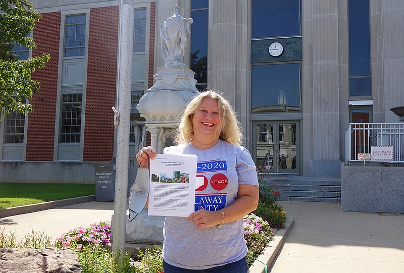 <p>Helen Wilbers/For the News Tribune</p><p>Callaway 200 scavenger hunt organizer Kelly Borman smiles outside one of the most well-known stops on the hunt: the Callaway County Courthouse. The scavenger hunt officially begins Oct. 1 and ends Nov. 13.</p>