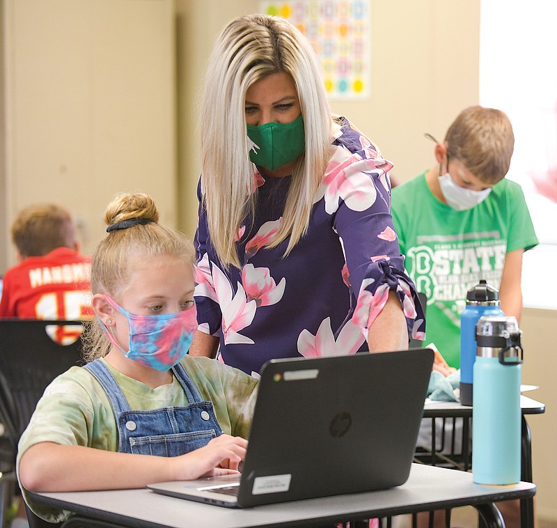 Tiffany Fitzpatrick works with Blayne Bailey, one of her fifth-grade students during social studies class Thursday, Sept. 10, 2020, at Blair Oaks Middle School. 