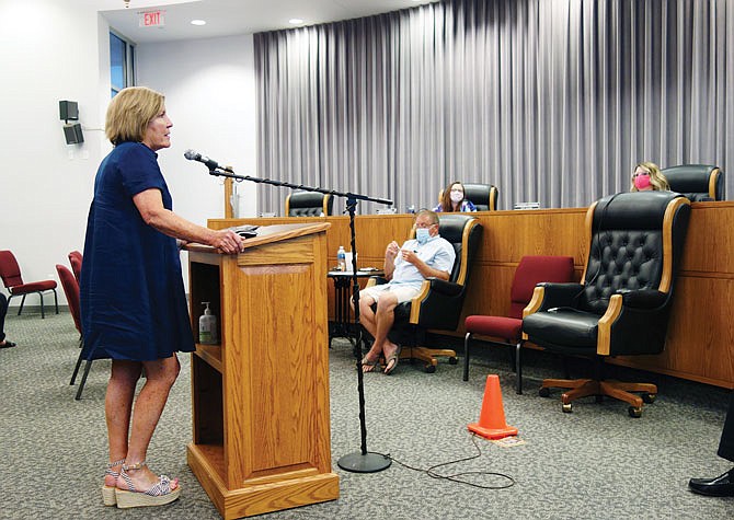 Kathy Holschlag, Fulton's chief financial officer, addresses the Fulton City Council during a previous meeting. On Tuesday night, she informed council members that utility shutoffs have resumed.