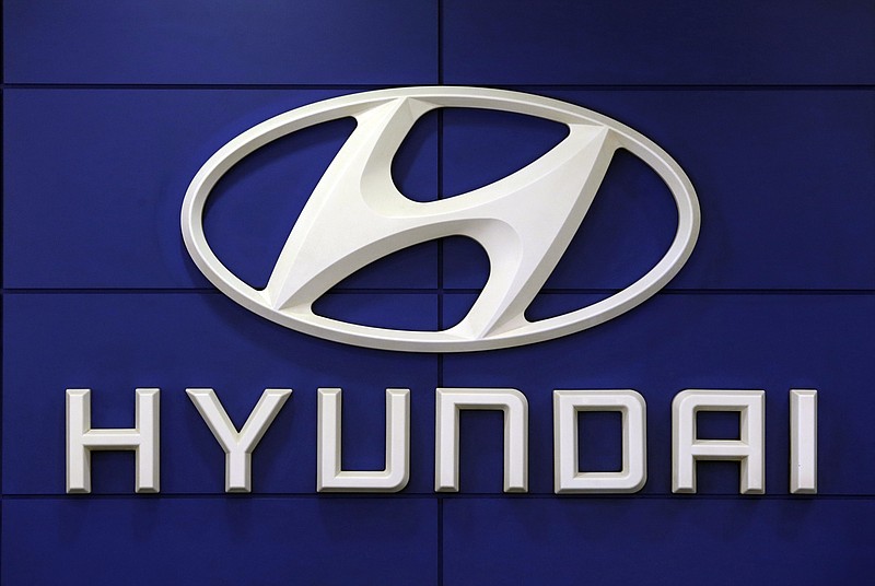 FILE - In this July 26, 2018 file photo, the logo of Hyundai Motor Co. is seen at its showroom in Seoul, South Korea. For the second time this month, Hyundai is telling some SUV owners to park outdoors because an electrical short in a computer can cause vehicles to catch fire. The Korean automaker is recalling about 180,000 Tucson SUVs in the U.S. from 2019 through 2021 to fix the problem.  (AP Photo/Ahn Young-joon, File)